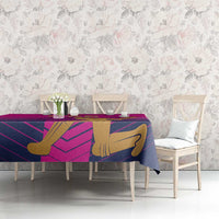 Pink UAE cricket tablecloth covering dining table with gold batsman and purple stripes