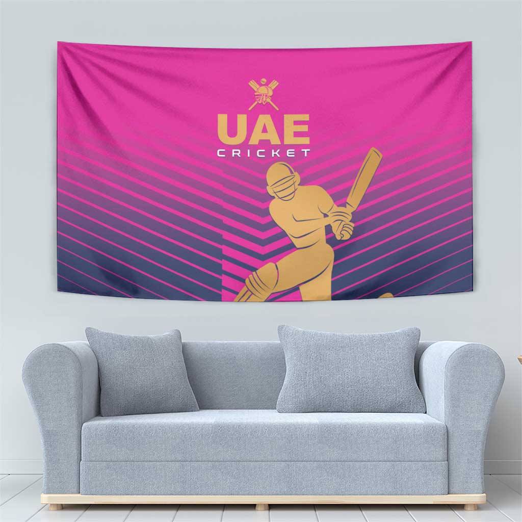 Pink UAE Cricket wall tapestry with gold UAE Cricket lettering and player illustration.