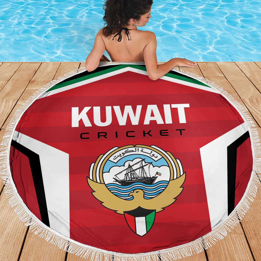 Round Kuwait cricket blanket with crest emblem, fringe border, held out on wooden deck