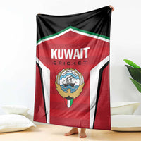Red, white, and black cricket blanket with Kuwait Cricket logo on hanging display