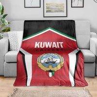 Red, white, and black Kuwait Cricket blanket with central logo and text
