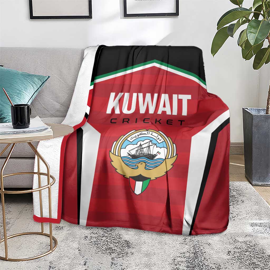 Red, white, and black cricket blanket with Kuwait Cricket emblem draped over couch