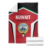 Folded red, white, and black Kuwait Cricket blanket with emblem and team text