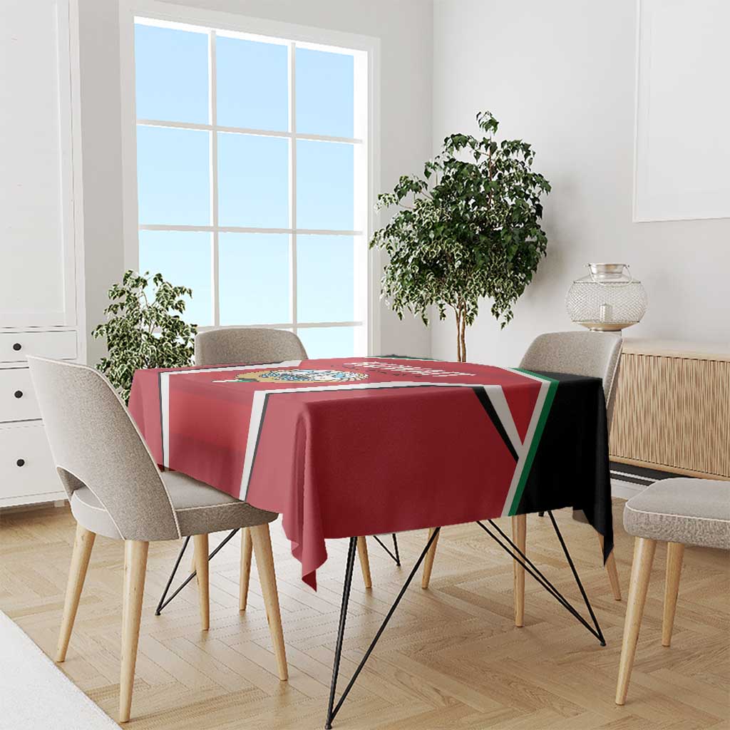 Red Kuwait Cricket tablecloth draped on round table with black, white, green stripe trim