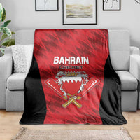 Cricket team blanket on sofa, red and black with Bahrain Cricket crest