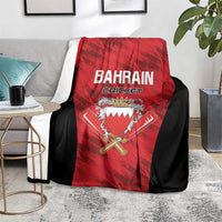 Bahrain Cricket blanket on gray couch, red center logo with black trim