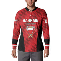 Red Bahrain Cricket button sweatshirt on model, black side panels and striped cuffs