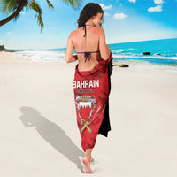 Red and black Bahrain Cricket sarong tied at waist, full length with crest