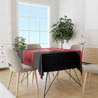 Bahrain cricket tablecloth draped on dining table, red center with black edges