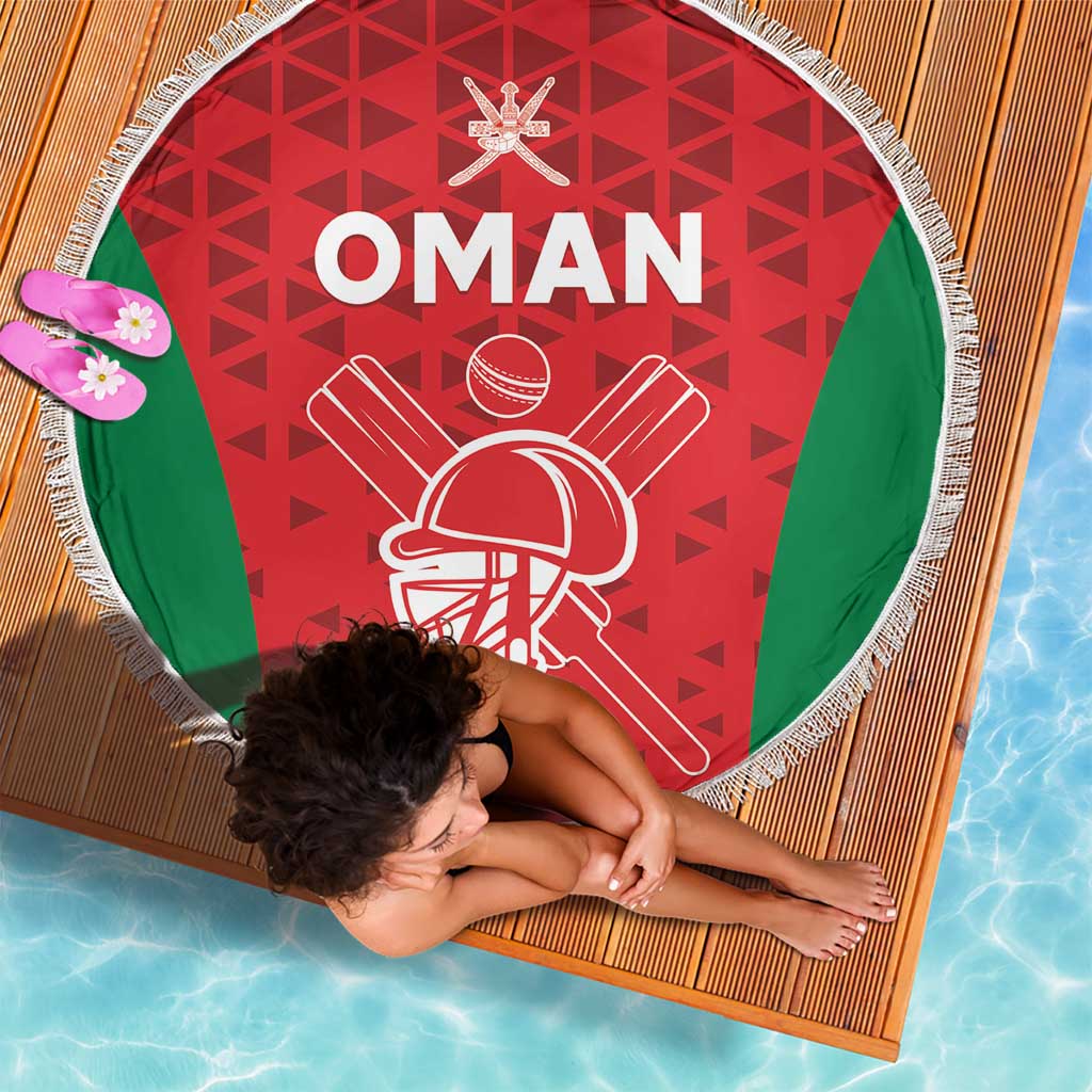 Round Oman cricket beach blanket with red geometric pattern, green side panels, white fringe
