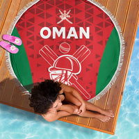 Round Oman cricket beach blanket with red geometric pattern, green side panels, white fringe