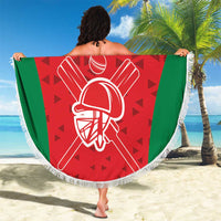 Round red Oman cricket beach blanket with green sides and white fringe tassels