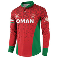 Red and green cricket button sweatshirt with 'OMAN' lettering and crest, long sleeves