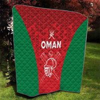 Oman cricket quilt blanket with red triangle, green panels, and white “OMAN” badge