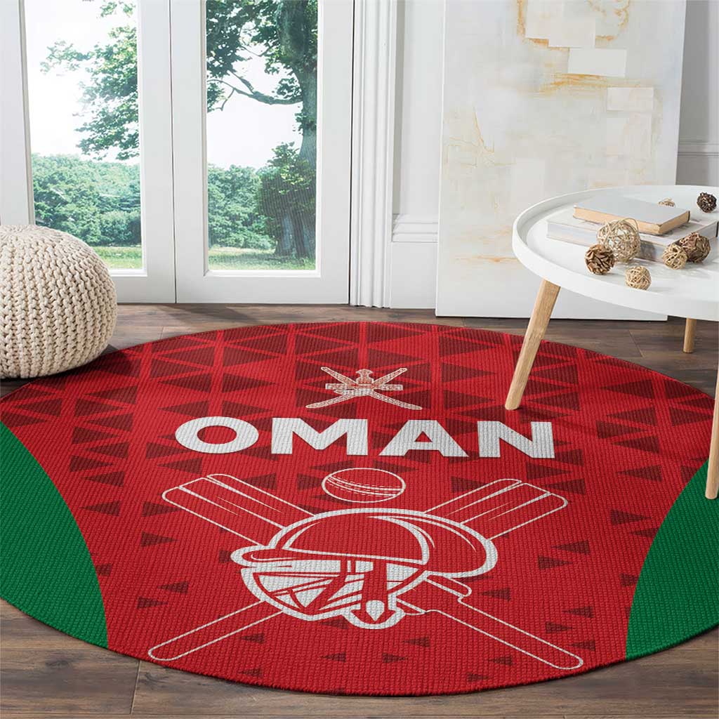 Red round cricket rug with Oman text and cricket helmet graphic, green border
