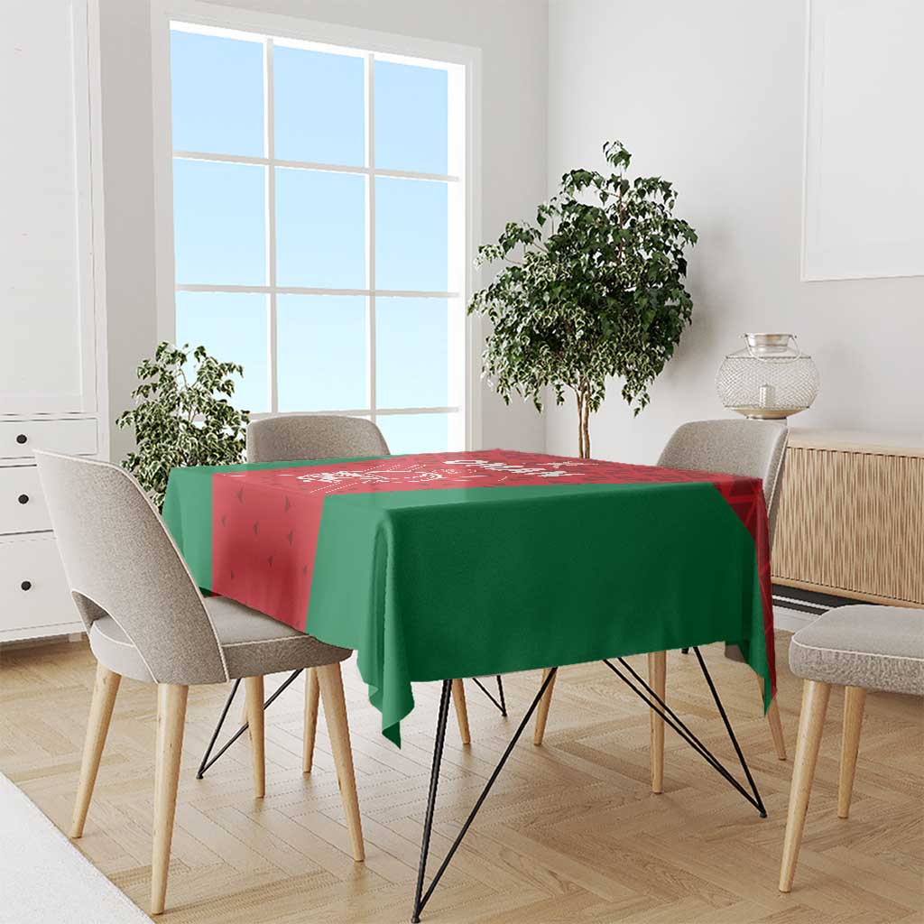 Oman cricket tablecloth draped on dining table, red center with green sides and cricket logo