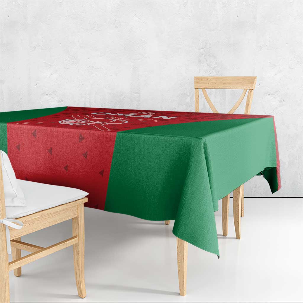 Oman cricket tablecloth with red corner panel and green side panels, folded over table edge