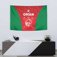 Green and red Oman tapestry wall hanging with white crest and crossed swords