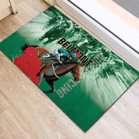 Green rubber doormat runner featuring a racing horse, red floral splash, and BELMONT
