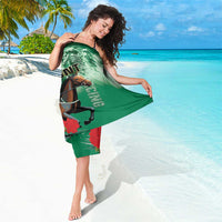 Green Belmont horse racing sarong with jockey graphic, worn as a short draped wrap