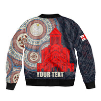 Unisex dark bomber jacket with red cathedral graphic, blue pattern sleeves, ribbed hem