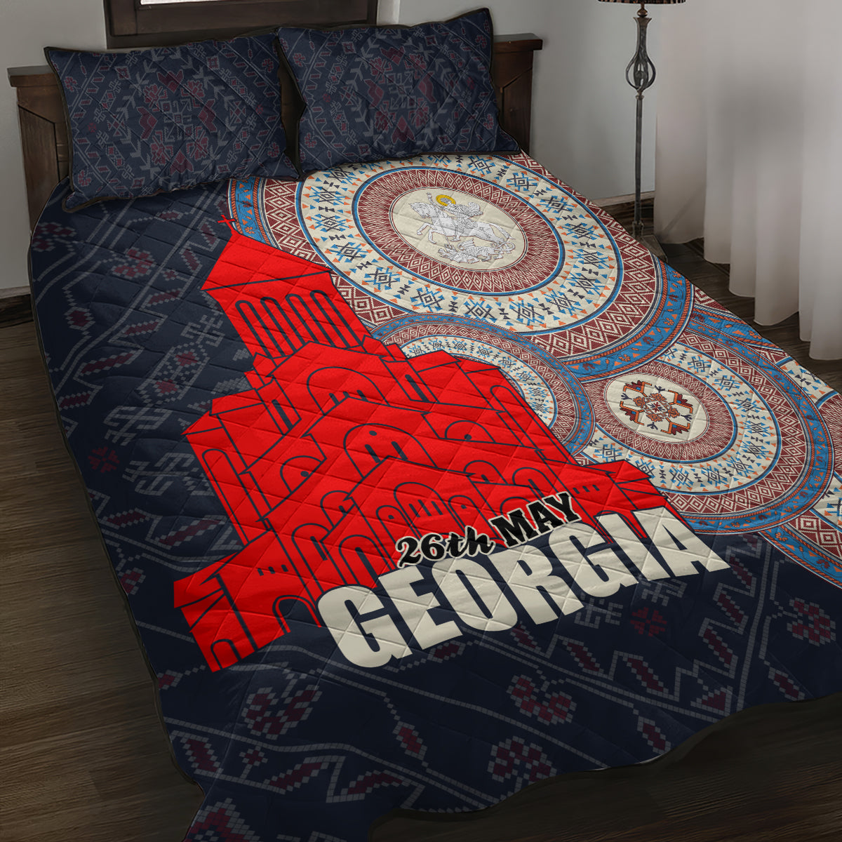 Quilt bed set with dark blue cover, red “GEORGIA” text, circular medallion design