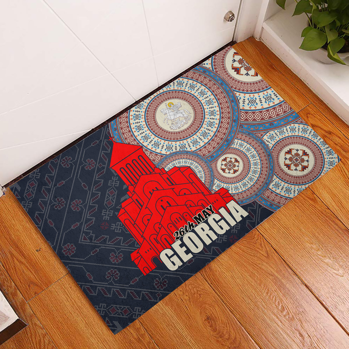 Rubber doormat with dark gray pattern, blue medallions, and red Georgia graphic