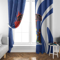 Blue curtain panels with Toronto logo and shield graphic on a bright window