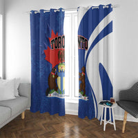 Blue Toronto curtains with ring-style top and shield artwork, two panels