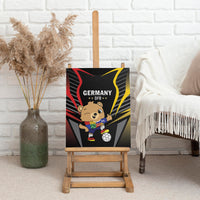 Black canvas wall art in frame featuring Germany bear with soccer ball and red/yellow streaks