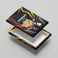 Black canvas print on wooden base, Germany bear with soccer ball and red/yellow swoosh