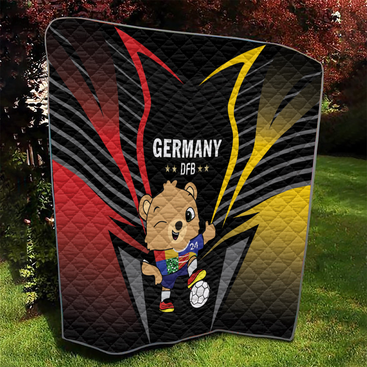 Black Germany 2024 football quilt with DFB text, bear mascot, soccer ball, red and yellow rays