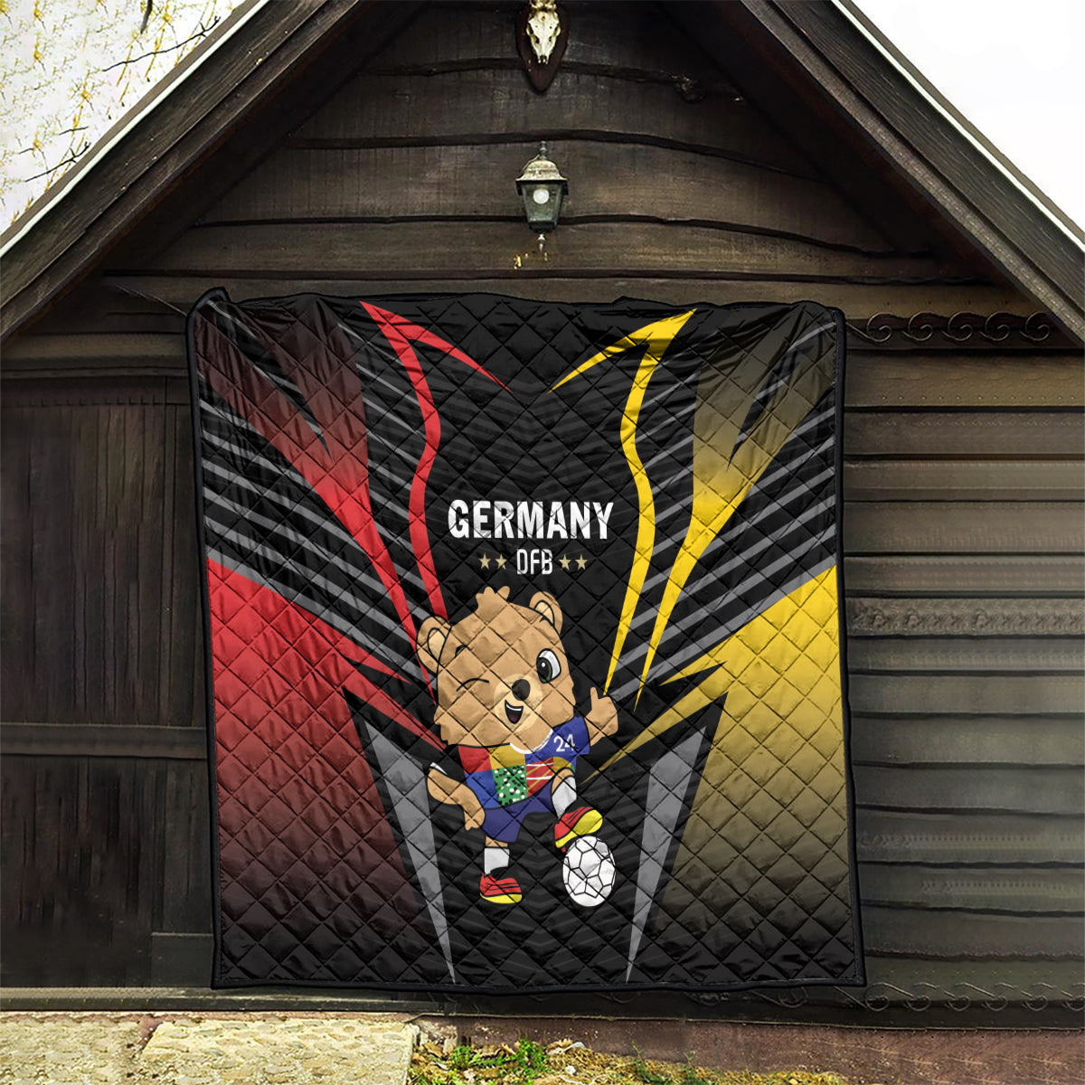 Black Germany DFB football quilt with bear mascot holding soccer ball and red/yellow rays