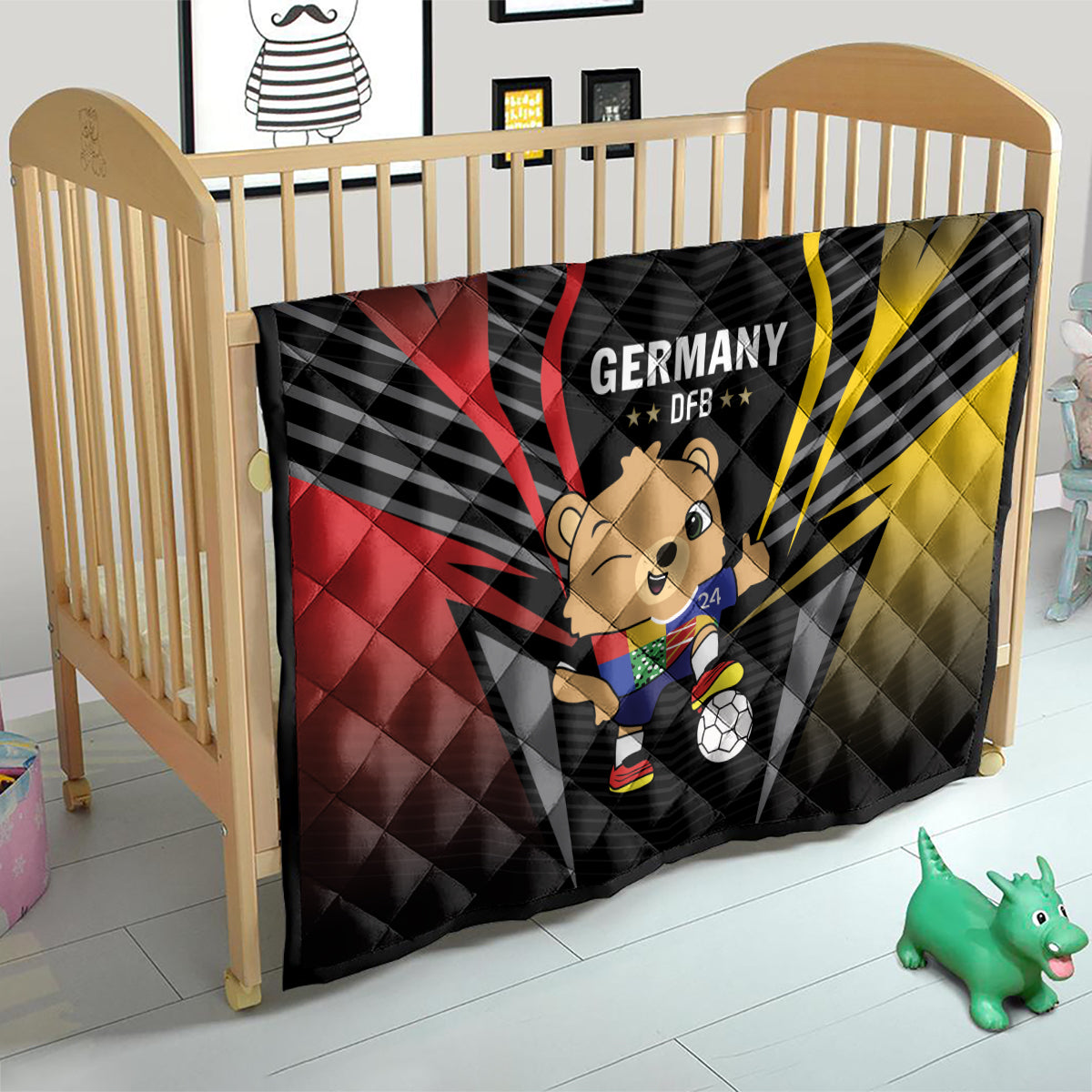 Black Germany DFB quilt draped on crib with bear mascot, soccer ball, and red/yellow rays
