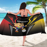 Black Germany DFB football sarong draped on back, showing mascot and Germany text