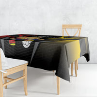 Black football tablecloth draped on a table with bold yellow stripe and Germany graphics