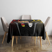 Black football tablecloth with Germany 2024 emblem and soccer ball print on a dining table