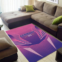 Pink and purple Germany DFB area rug under living room sofa, “GERMANY DFB” emblem in stripes