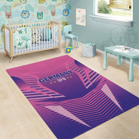 Pink and purple Germany DFB area rug with central “GERMANY DFB” logo and striped lines