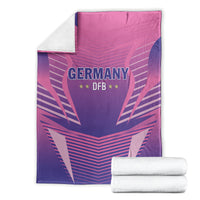 Pink and purple Germany DFB football blanket with bold team logo, neatly folded at corner.