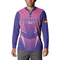 Pink and navy football button sweatshirt with Germany DFB emblem and striped chevron design.