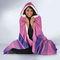 Pink hooded Germany football blanket on model, sherpa lining and purple stripe pattern