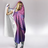 Model wearing pink Germany football hooded blanket, hood up and purple stripe pattern