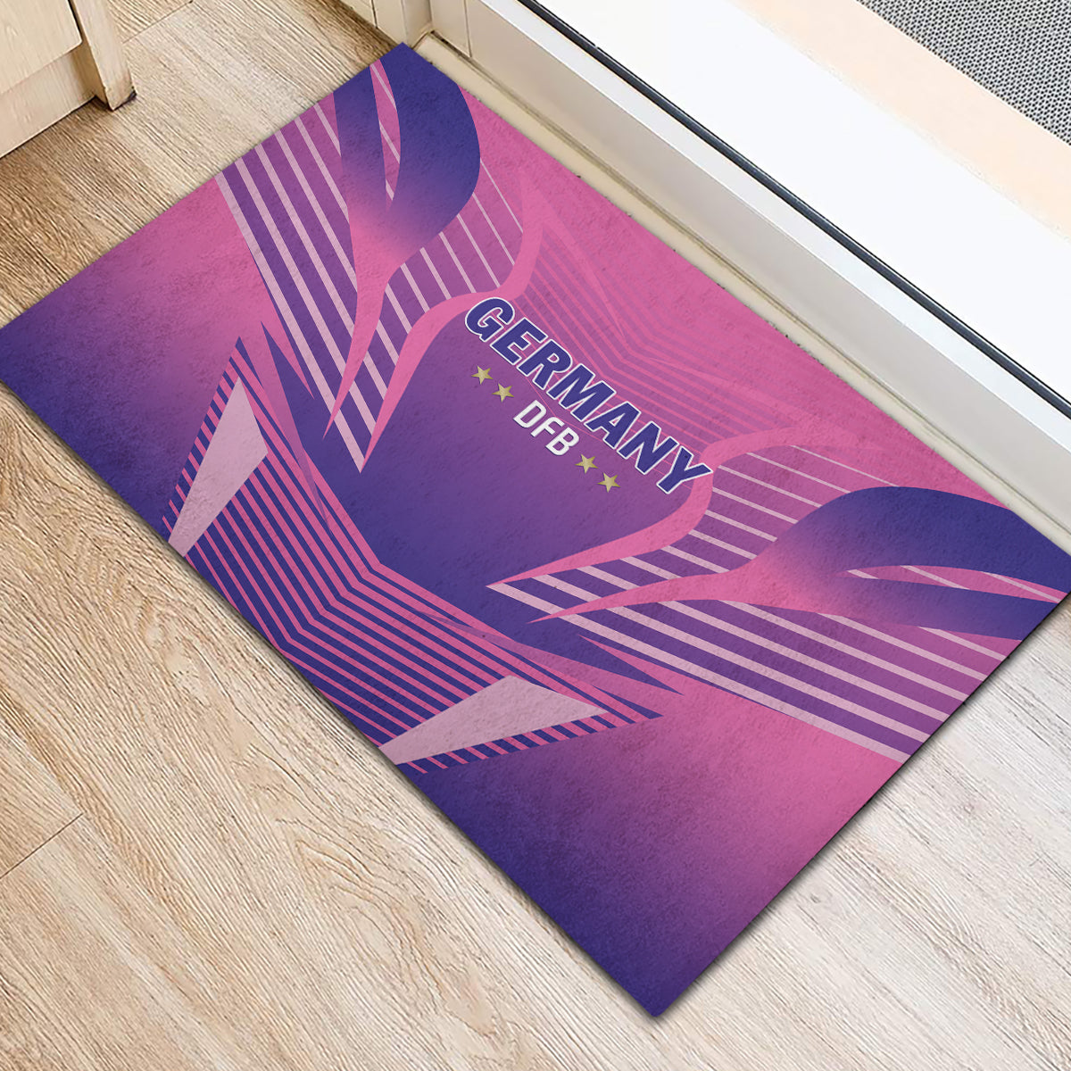 Pink and purple rubber doormat with Germany DFB logo, hearts and striped graphics