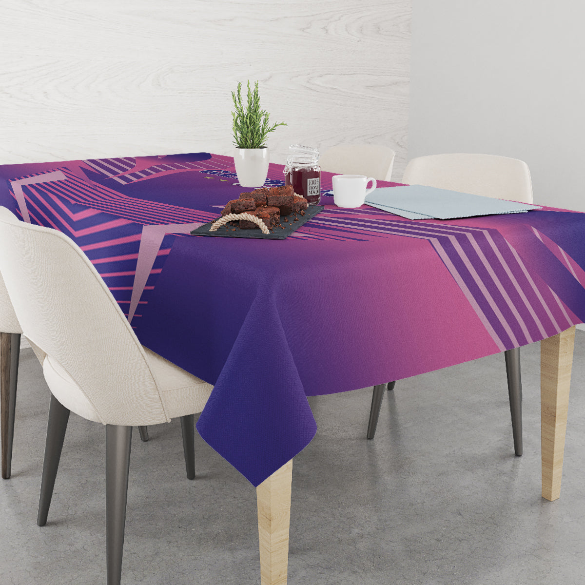 Pink and purple football tablecloth with geometric stripes, draped on a dining table
