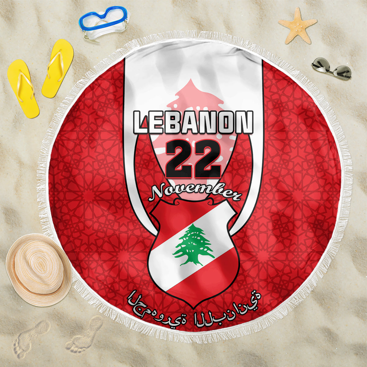 Round red beach blanket with Lebanese crest graphic and white fringe edge