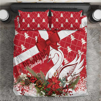 Red Christmas bedding set with pillow covers, bow detail, and swan feather print