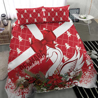 Red and white Christmas bedding set with large bow and swan feather design
