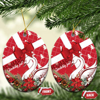 Red ceramic Christmas ornament with coquette bow and swan motif, oval shape