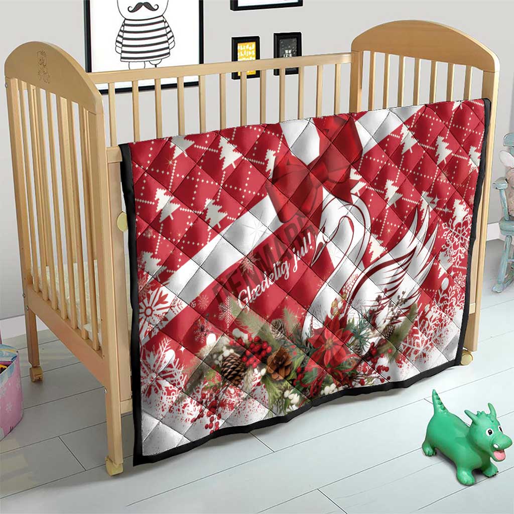 Red holiday quilt on a child bed with white stripes, star center, swan and florals